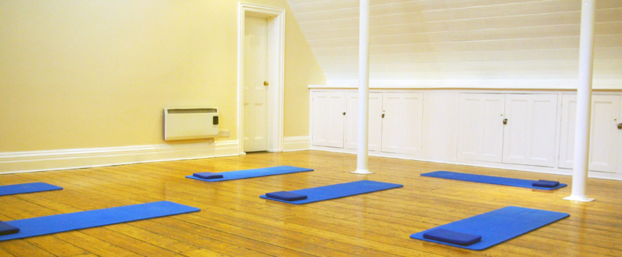 Room with Pilates mats laid out on the floor ready for a matwork class